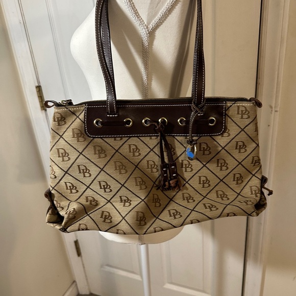 Vintage Dooney & Bourke signature canvas with brown leather trim. - Picture 1 of 13
